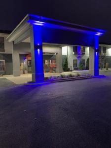 a blue object in front of a building at night at Days Inn by Wyndham Great Lakes - N. Chicago in North Chicago