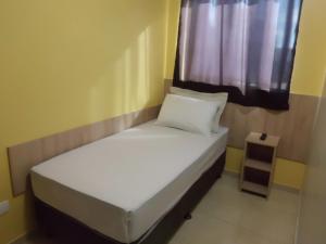 Cama ou camas em um quarto em Hotel Cabbu