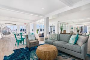 a living room with a couch and a table at The Cove at Rockport in Rockport