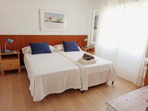 Krevet ili kreveti u jedinici u okviru objekta Casa Sanabria habitaciones privadas en una vivienda particular