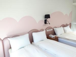 Postel nebo postele na pokoji v ubytování Dong Bi Villa