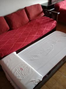 Giường trong phòng chung tại Apart Hotel Marilian