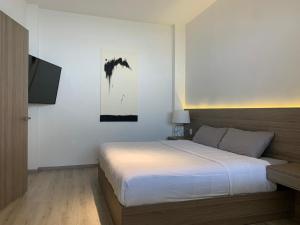 Hotel Blanco Pachuca客房内的一张或多张床位