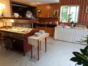 A kitchen or kitchenette at Mirana Family Hotel