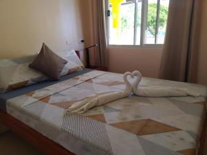 Postel nebo postele na pokoji v ubytování JPH Resort