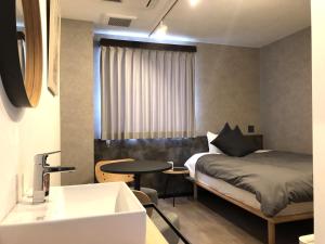 מיטה או מיטות בחדר ב-Hotel Sun Road