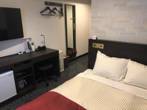 Postel nebo postele na pokoji v ubytování Ai Hotel Keikyu Kamata