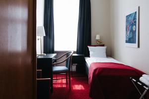 Postel nebo postele na pokoji v ubytování City Hotel Nebo