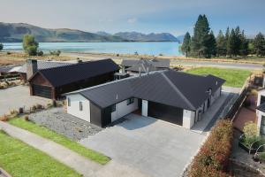 an overhead view of a house with a black roof at Alice Garden in Lake Tekapo
