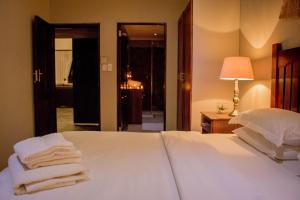 African Safari Lodge客房内的一张或多张床位