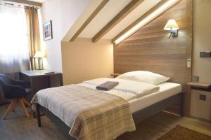 Posteľ alebo postele v izbe v ubytovaní Hotel Via Ironia