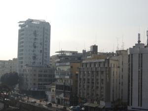 a view of a city with tall buildings at Delphi Hotel in Nicosia