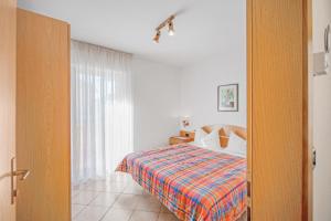 Postel nebo postele na pokoji v ubytování Appartamento Aloch