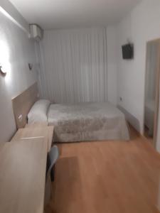 Postel nebo postele na pokoji v ubytování Hotel Condestable