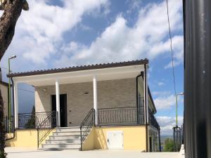 a building with a balcony on the side of it at L'ANGELICA AFFITTACAMERE in Grottaminarda