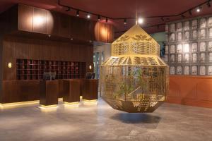 a large gold chandelier in the middle of a room at Vaeshartelt Maastricht in Maastricht