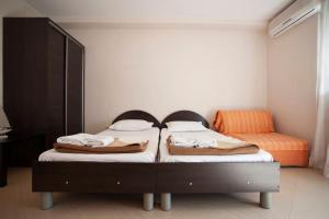 Ліжко або ліжка в номері Mandir apartments - Center