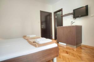 Ліжко або ліжка в номері Mandir apartments - Center