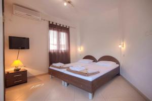 Ліжко або ліжка в номері Mandir apartments - Center