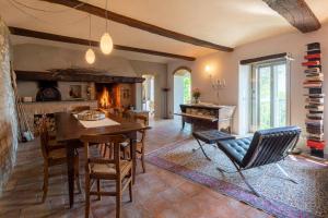 a living room with a table and a piano at "Luisa's Smile" in Guarene +19 photos