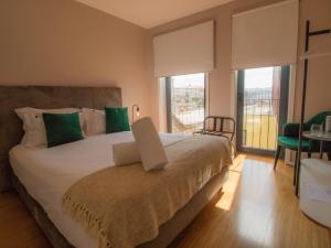 En eller flere senge i et værelse på ALIBI by YoursPorto