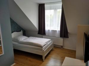 Postel nebo postele na pokoji v ubytování Das Gartenhaus