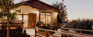 a small house with a fence in front of it at Locanda Orvieto Agriturismo in Orvieto