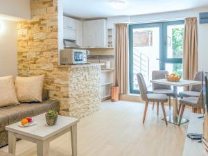 a living room with a couch and a table at Square Point Apartments in Kotor