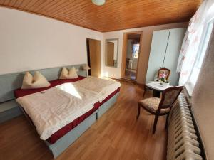 מיטה או מיטות בחדר ב-Gasthof Zum Amboss