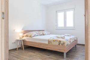 Postel nebo postele na pokoji v ubytování Apartments Žilić