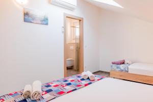 Postel nebo postele na pokoji v ubytování Apartments Žilić