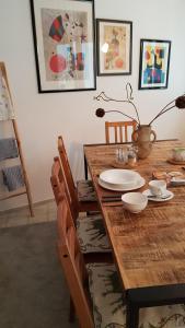 a wooden table with chairs and a dining room at Haus Alfina in Alf