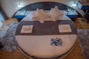 Postel nebo postele na pokoji v ubytování Hotel Marami