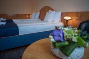 Postel nebo postele na pokoji v ubytování Hotel Marami