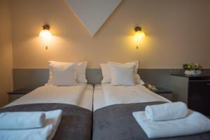 Postel nebo postele na pokoji v ubytování Hotel Marami