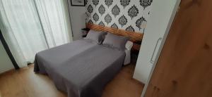 a bedroom with a bed in a room at Hostal La Lluna in Arenys de Mar
