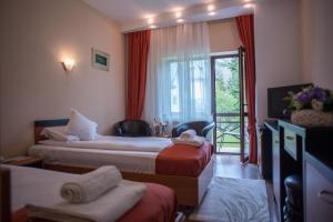 Postel nebo postele na pokoji v ubytování Hotel Marami