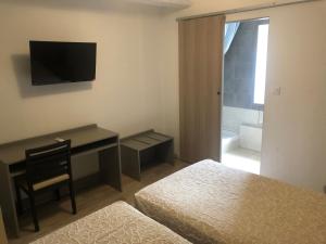 TV a/nebo společenská místnost v ubytování Hotel Aurelia