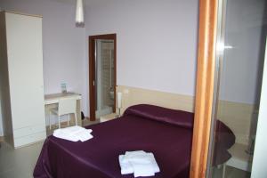 Postel nebo postele na pokoji v ubytování B&B Angolo Felice