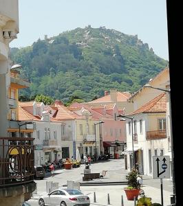 a view of a town with a mountain in the background at Casa Azul Hostel in Sintra