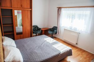 Posteľ alebo postele v izbe v ubytovaní Dom Gościnny "Satori"