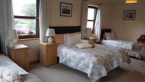 Rúm í herbergi á Corrib View Lodge