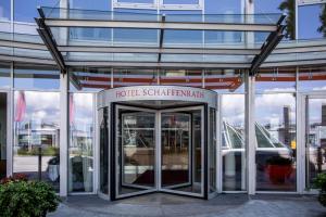 an entrance to a building with a revolving door at Apartment-Hotel Schaffenrath in Salzburg