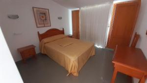 Łóżko lub łóżka w pokoju w obiekcie Hostal Restaurante Pinarejo
