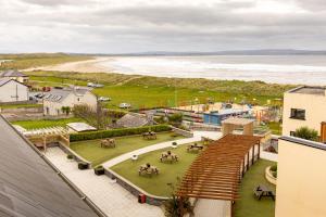a view of the beach from the roof of a building at Ocean Sands Hotel in Enniscrone