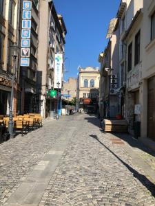 an empty street in a city with buildings at Gabroveni Aparthotel in Bucharest