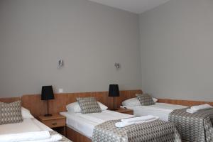 Postel nebo postele na pokoji v ubytování Hotel Jan Sander