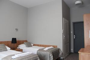 Postel nebo postele na pokoji v ubytování Hotel Jan Sander