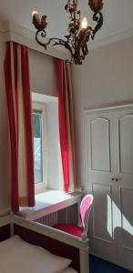 Postel nebo postele na pokoji v ubytování Hotel Hohenstauffen