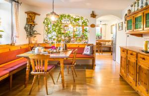 a dining room with a table and chairs at Bio Bauernhof Schweizerhof in Bad Hofgastein